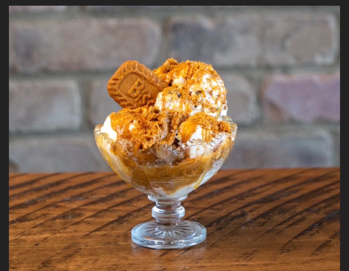 Sundae in a glass with ice cream, caramel and Lotus Biscoff cookie crumbs